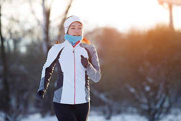 Image showing Photo of jogging young athlete