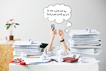 Image showing The many crumpled papers on desk of stressed male workplace