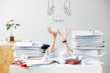 Image showing The many crumpled papers on desk of stressed male workplace