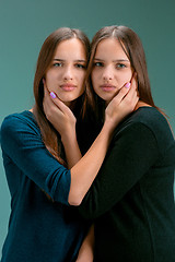 Image showing Portrait of two beautiful twin young women