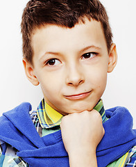 Image showing young pretty little cute boy kid wondering, posing emotional face isolated on white background, gesture happy smiling close up, lifestyle people concept