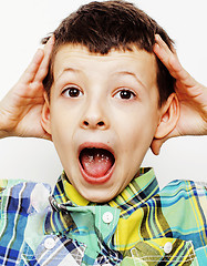 Image showing young pretty little cute boy kid wondering, posing emotional face isolated on white background, gesture happy smiling close up, lifestyle people concept