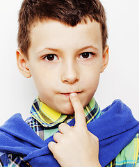 Image showing young pretty little cute boy kid wondering, posing emotional face isolated on white background, gesture happy smiling close up, lifestyle people concept