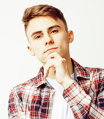 Image showing young handsome teenage hipster guy posing emotional, happy smiling against white background isolated, lifestyle people concept 