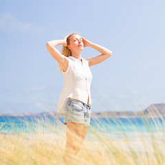 Image showing Free Happy Woman Enjoying Sun on Vacations.