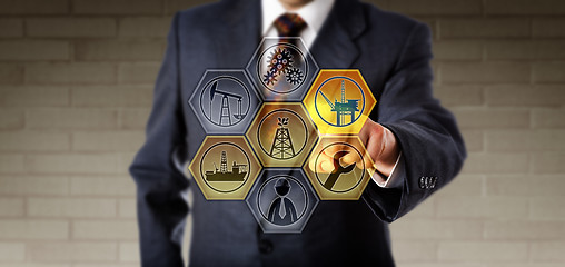 Image showing Service Manager Touching A Virtual Oil Rig Icon