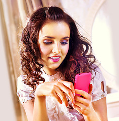 Image showing woman with pink smartphone