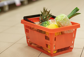 Image showing food basket on grocery or supermarket floor