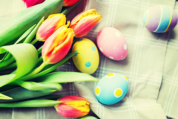 Image showing close up of colored easter eggs and flowers