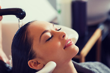 Image showing happy young woman at hair salon