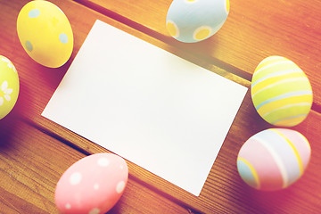 Image showing close up of easter eggs and blank white paper