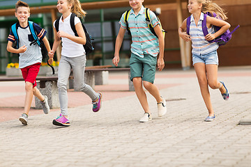 Image showing group of happy elementary school students running