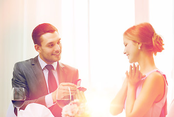 Image showing man proposing to his girlfriend at restaurant