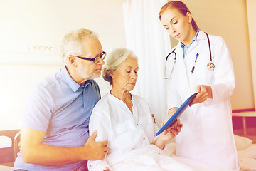 Image showing senior woman and doctor with tablet pc at hospital