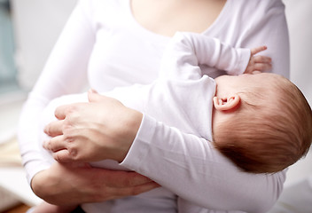 Image showing close up of mother holding newborn baby