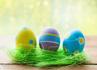 Image showing close up of colored easter eggs and grass