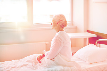 Image showing senior woman patient lying in bed at hospital ward