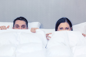 Image showing happy couple sleeping in bed