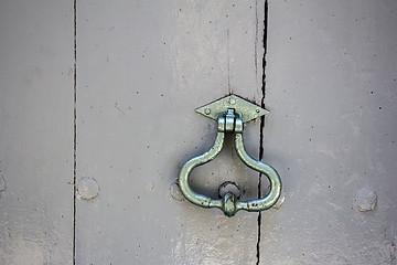 Image showing Old door knocker on an old wooden entrance door
