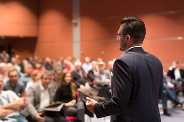 Image showing Speaker giving talk at business conference event.