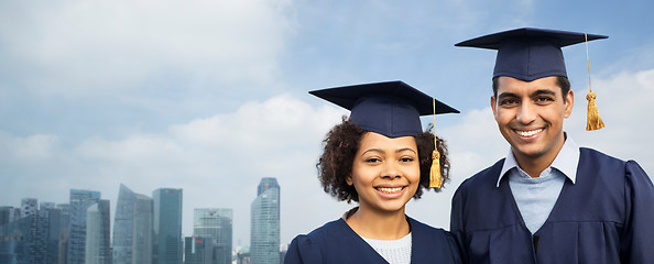 Image showing students or bachelors in mortar boards over city