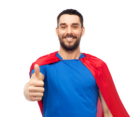 Image showing happy man in red superhero cape showing thumbs up