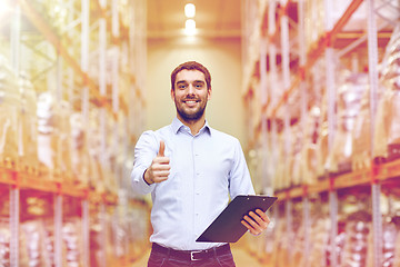 Image showing happy man at warehouse showing thumbs up gesture