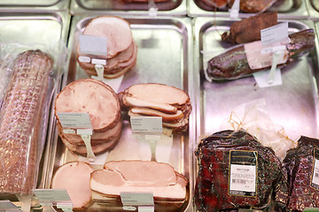 Image showing ham at grocery store stall