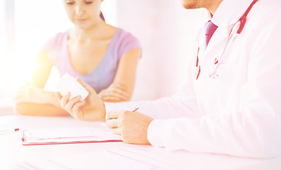 Image showing patient and doctor prescribing medication