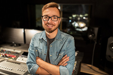 Image showing man at mixing console in music recording studio