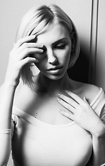 Image showing young stylish woman sensual posing with hands on face, black and white lifestyle  sexy people concept