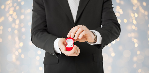 Image showing close up of man with engagement ring in gift box