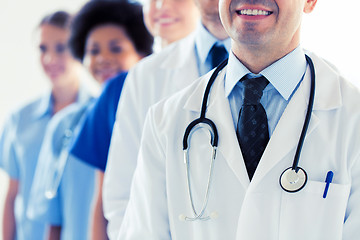 Image showing close up of happy doctors with stethoscope