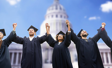 Image showing happy students or bachelors celebrating graduation