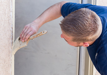 Image showing Professional Painter Cutting In With Brush to Paint House Door F