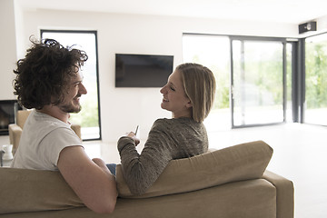 Image showing Rear view of couple watching television