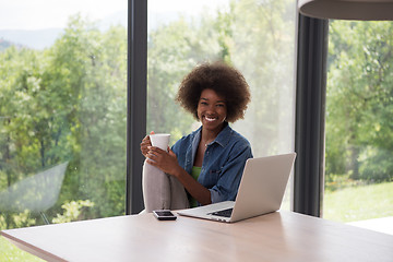 Image showing African American woman in the living room