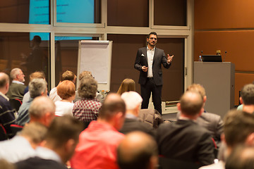 Image showing Business speaker giving a talk in conference hall.