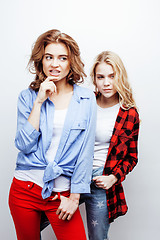 Image showing two pretty blond woman having fun together on white background, mature mother and young teenage daughter, lifestyle people concept