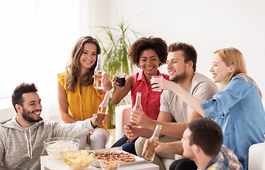 Image showing happy friends with drinks having party at home