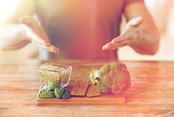 Image showing close up of male hands showing food rich in fiber