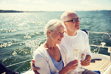 Image showing senior couple drinking champagne on sail boat