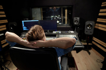 Image showing man at mixing console in music recording studio