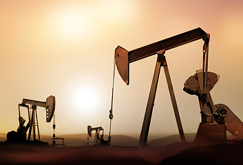 Image showing silhouette of retro oil pumps