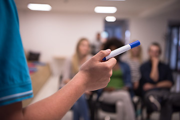 Image showing close up of teacher hand with marker