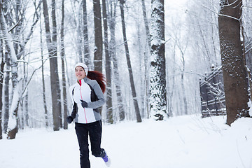 Image showing Photo of young sportswoman running