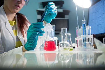 Image showing Girl with laboratory test tubes