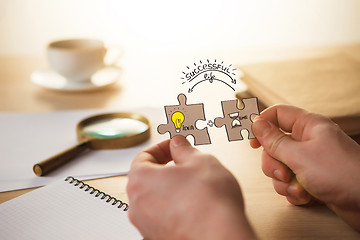 Image showing Building a business success. The hands with puzzles