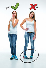 Image showing conceptual portrait of two beautiful twin young women