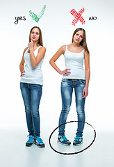 Image showing conceptual portrait of two beautiful twin young women